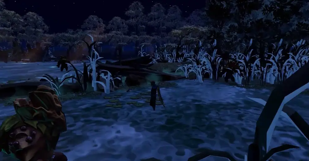 A robed figure walks through a moonlit, misty swamp lined with tall reeds and dark trees at night.